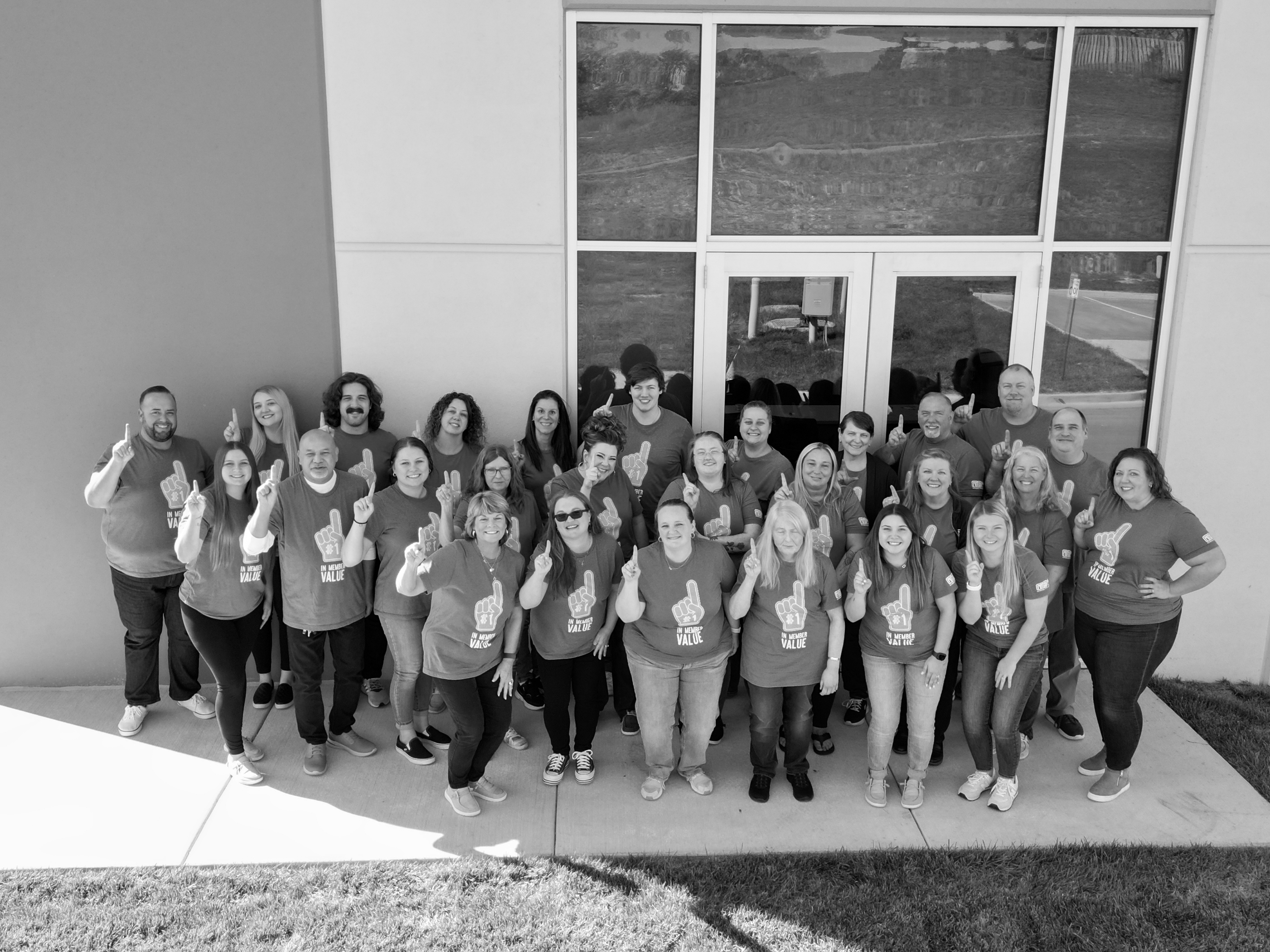 Image of R-G team members outside showing #1 sign.